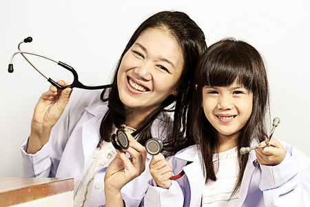 Doctor checked children girl's body in Clinicの写真素材