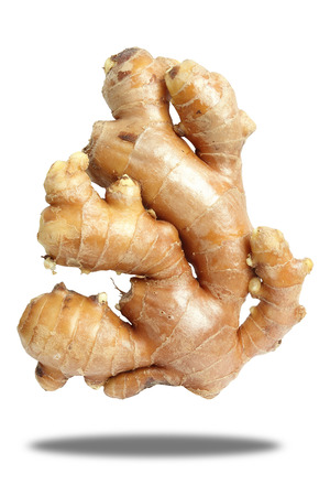 Close up fresh Ginger isolated on white の写真素材