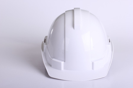 Close up Yellow safety hat isolated on white の写真素材