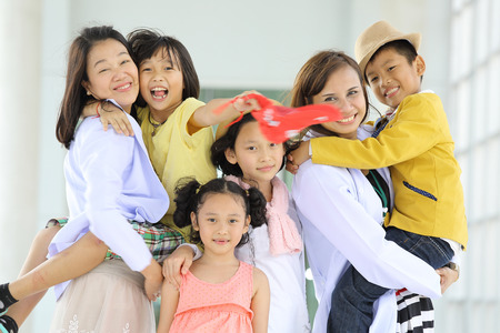 Smile children post together with their activityの写真素材