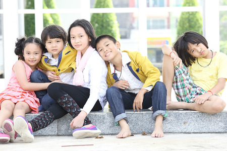 Smile children post together with their activityの写真素材