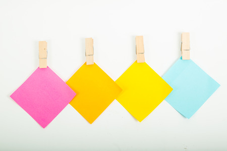 Small color paper note hang on with white background