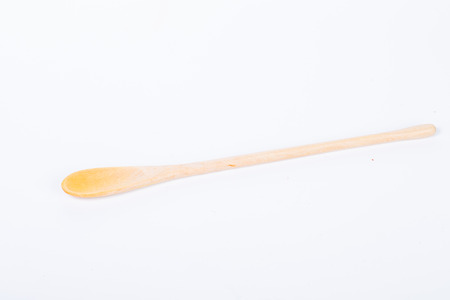 Wood spoon isolated placed on the white backgroundの写真素材