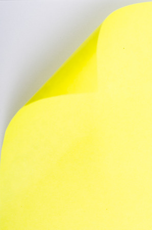Open conner of yellow paper for add your textの写真素材
