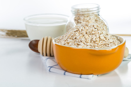Oat flakes pile on the white backgroundの写真素材