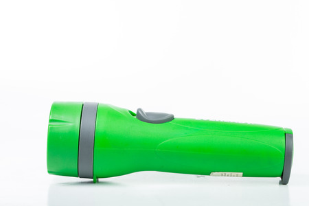 Green flashlight isolated with white backgroundの写真素材