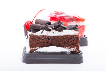 Piece of cake chocolate isolated with white background