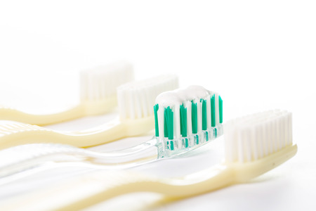 Three Toothbrushs isolate with white backgroundの写真素材