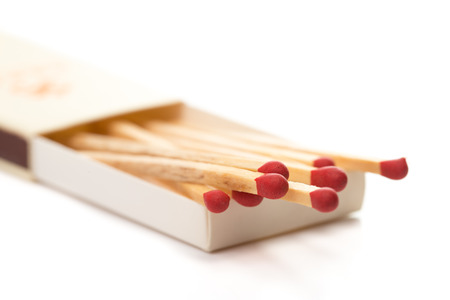 Red matchstick isolated with white backgroundの写真素材