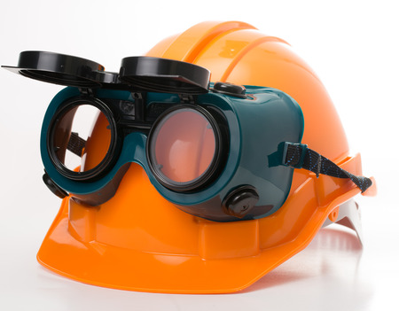 Safety hat and goggles glasse isolated with white background  aの写真素材
