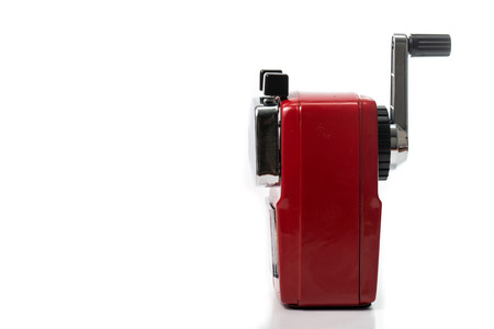 Red color metal pencil sharpener isolated with white backgroundの写真素材