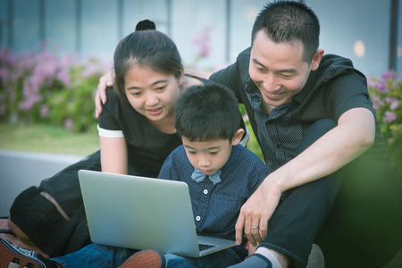 Asian Family portrait in sky garden outsideの写真素材