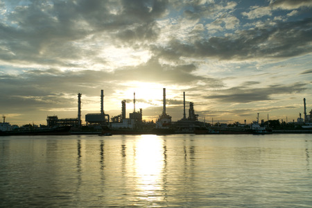 Oil refinery working for fuel in the future with Sun Riseの写真素材