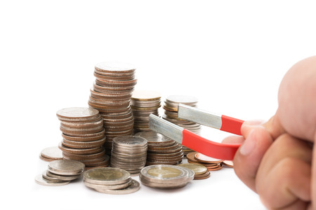 Businessman used large magnet for attracts benefit income with their marketing conceptの写真素材