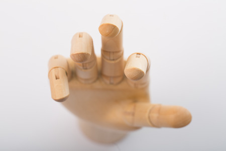 Wooden hand Point target to go on white backgroundの写真素材