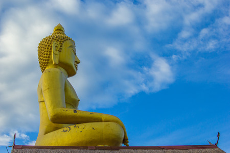 Buddha Statue with blue sky in Thailandの写真素材