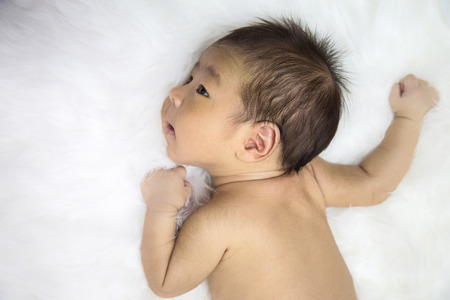 Studio portrait of an Asian baby with white backgroundの写真素材