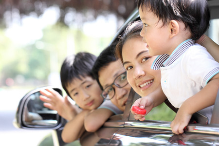 Travel Asian Family preparing with her son in the carの写真素材