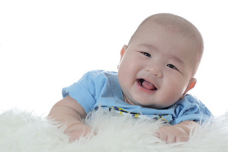 Portrait baby adorable baby looking confused with white backgroundの写真素材