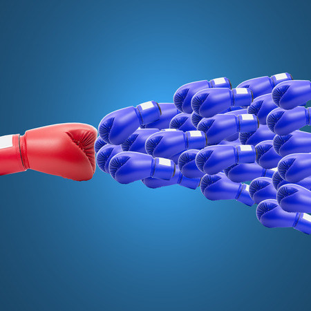 Boxing gloves challenge and competition with big companyの写真素材