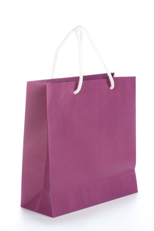 Purple paper bag with white backgroundの写真素材