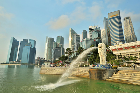 MARINA BAY ,SINGAPORE - March,14 2015: Early morning of Merlion Statue Landmark Singapore country with sun rise front of Marina Bay Sands Resort Hotel.のeditorial素材