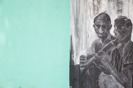 GEORGE TOWN,PENANG ,MALAYSIA- CIRCA March 26, 2015: Public street art Name Local painting on the wall by Local Artist in Georgetown, Penang, Malaysia.のeditorial素材