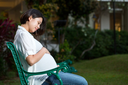 Pregnant ,Mam touch torso for feeling love their baby in home.の写真素材