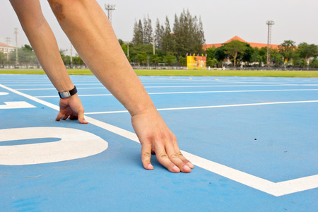 Blue running track in sport stadiumの写真素材