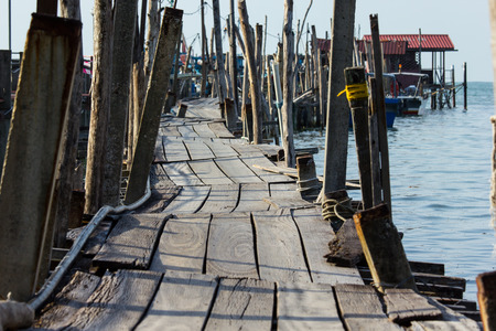 Old and ruin wood bridge in Twilight time.の写真素材