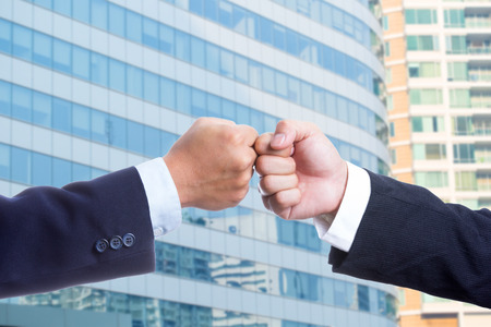 Businessman touch hands for deal thier business.の写真素材