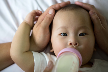 Sleeping Asian baby in studioの写真素材