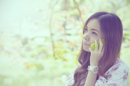 Young Asian women use smart phone for call and massage to her friend.の写真素材