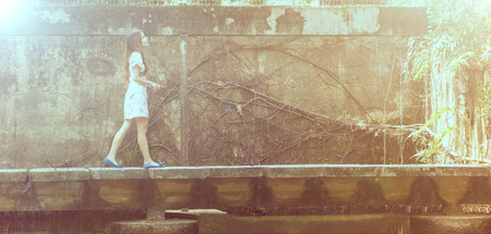 Portrait young adult post to photographer with Vintage toned color in the gardenの写真素材