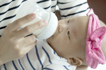 Sleeping Asian baby with white backgroundの写真素材
