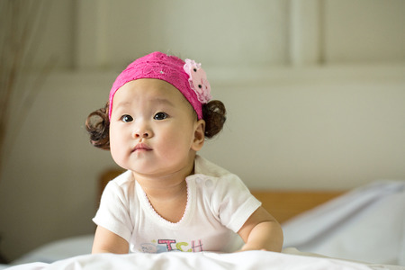 Sleeping Asian baby with white 