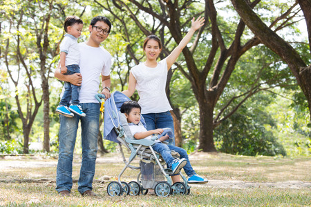 Happy Family enjoy and do activity together in Garden.