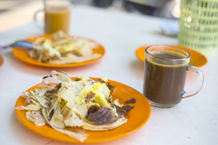 indian roti or Roti canai with curry sauceの写真素材