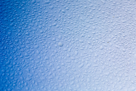 Blue Water drop background on the glass window.の写真素材