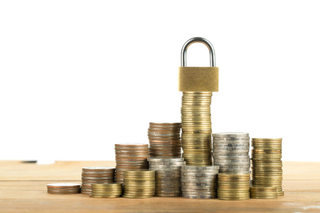 Lock and save your money with white background.の写真素材