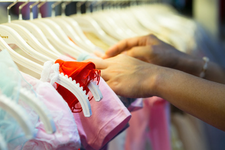 Select kids clothes in department store.の写真素材