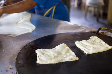 indian roti or Roti canai with curry sauceの写真素材