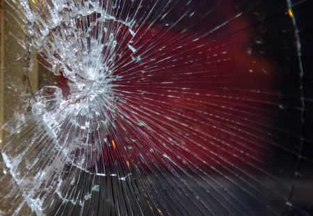 broken glass hole after crushed background.の写真素材