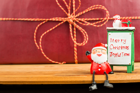 Santa claus 2016 sit down on the wood boardの写真素材