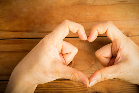 Female hand do hands heart on valentine day.の写真素材