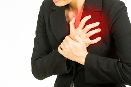 Heart attack woman.Business woman using hands for press her chest.