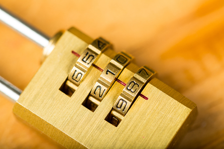 combination lock password on wood board.の写真素材