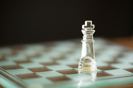 Chess glass start up game with your hand.