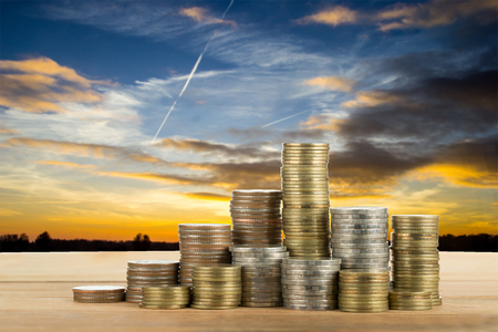 Save money with stack money coin for growing your businessの写真素材