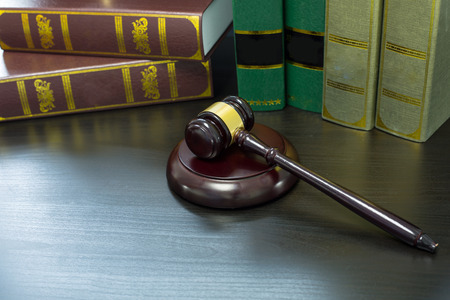 Wooden Judges gavel ,golden scales justice with black background.